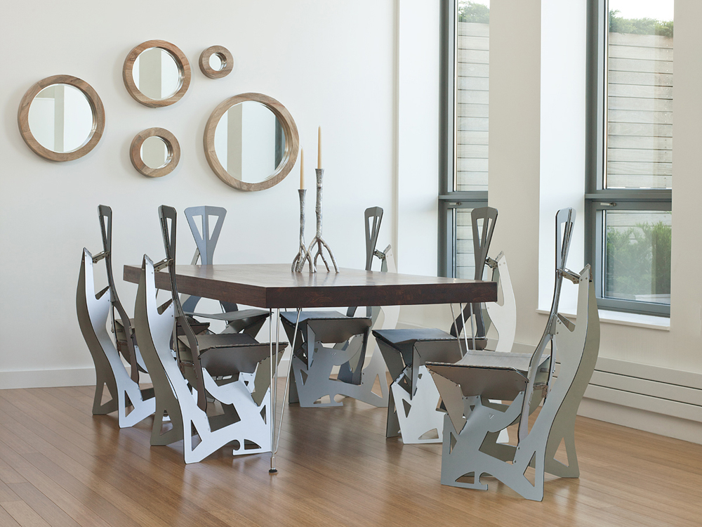 Six Leaf chairs around a dining table