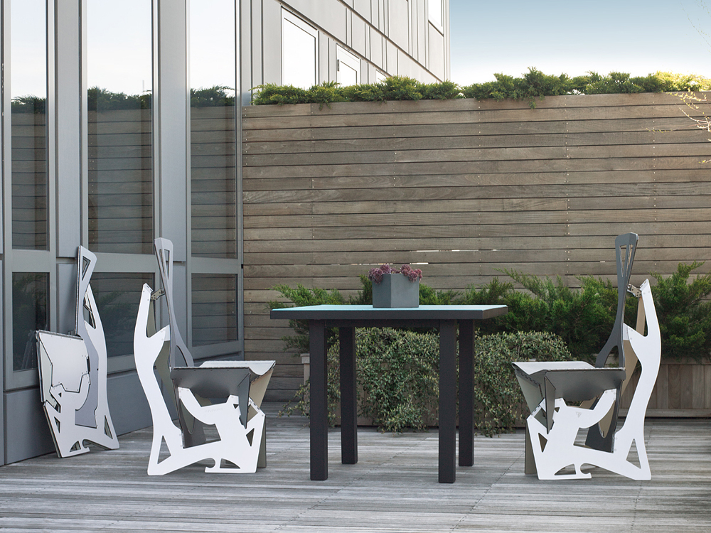 Three Leaf chairs on a terrace